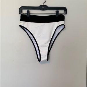 High waisted white and black bathing suit bottoms.